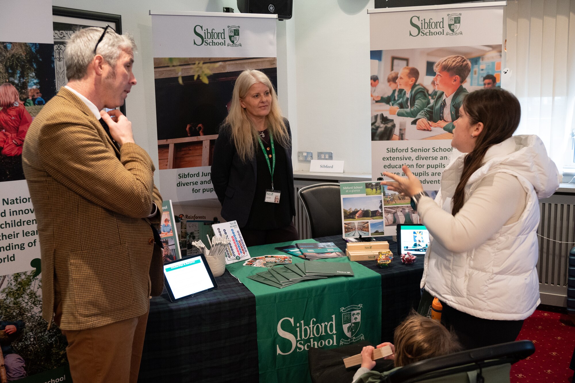 Pathfinders speak to representatives from local schools during a British school information fair