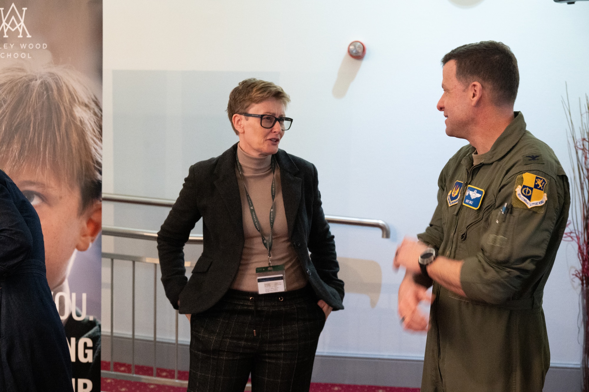 U.S. Air Force Col. Ricardo M. Diaz, 422nd Air Base Group commander, speaks to a representative from a local school