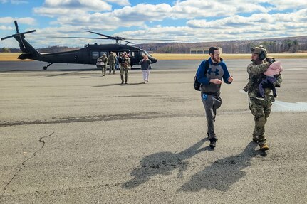 Airmen from the Kentucky Air National Guard’s 123rd Contingency Response Group receive flood victims arriving at the Big Sandy Regional Airport in Debord, Kentucky, Feb. 17, 2025.