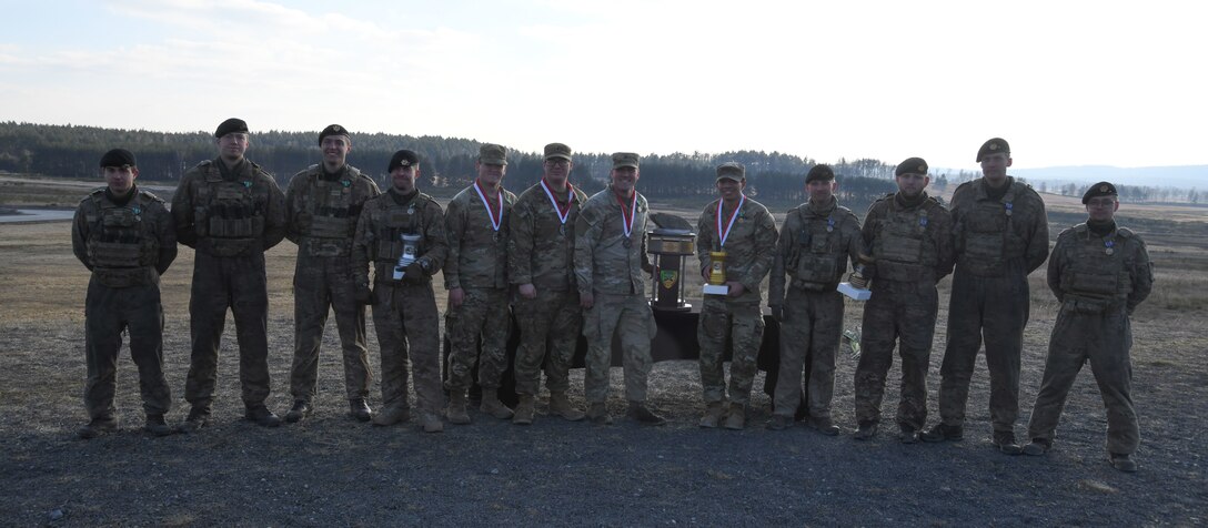 U.S and Danish soldiers pose for a photo