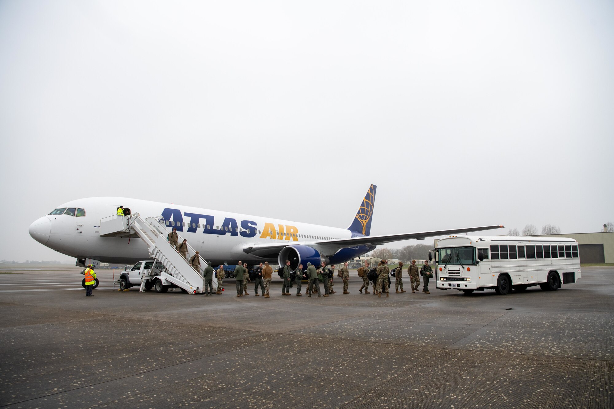 Airmen exit an Atlas Air Boeing 767 aircraft