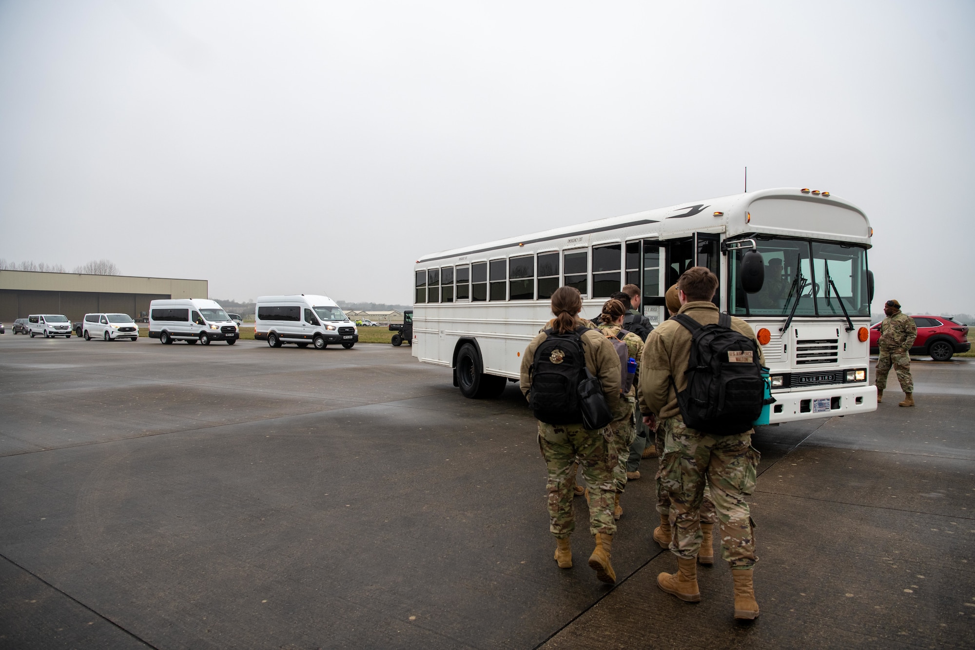 Airmen board a shuttle bus