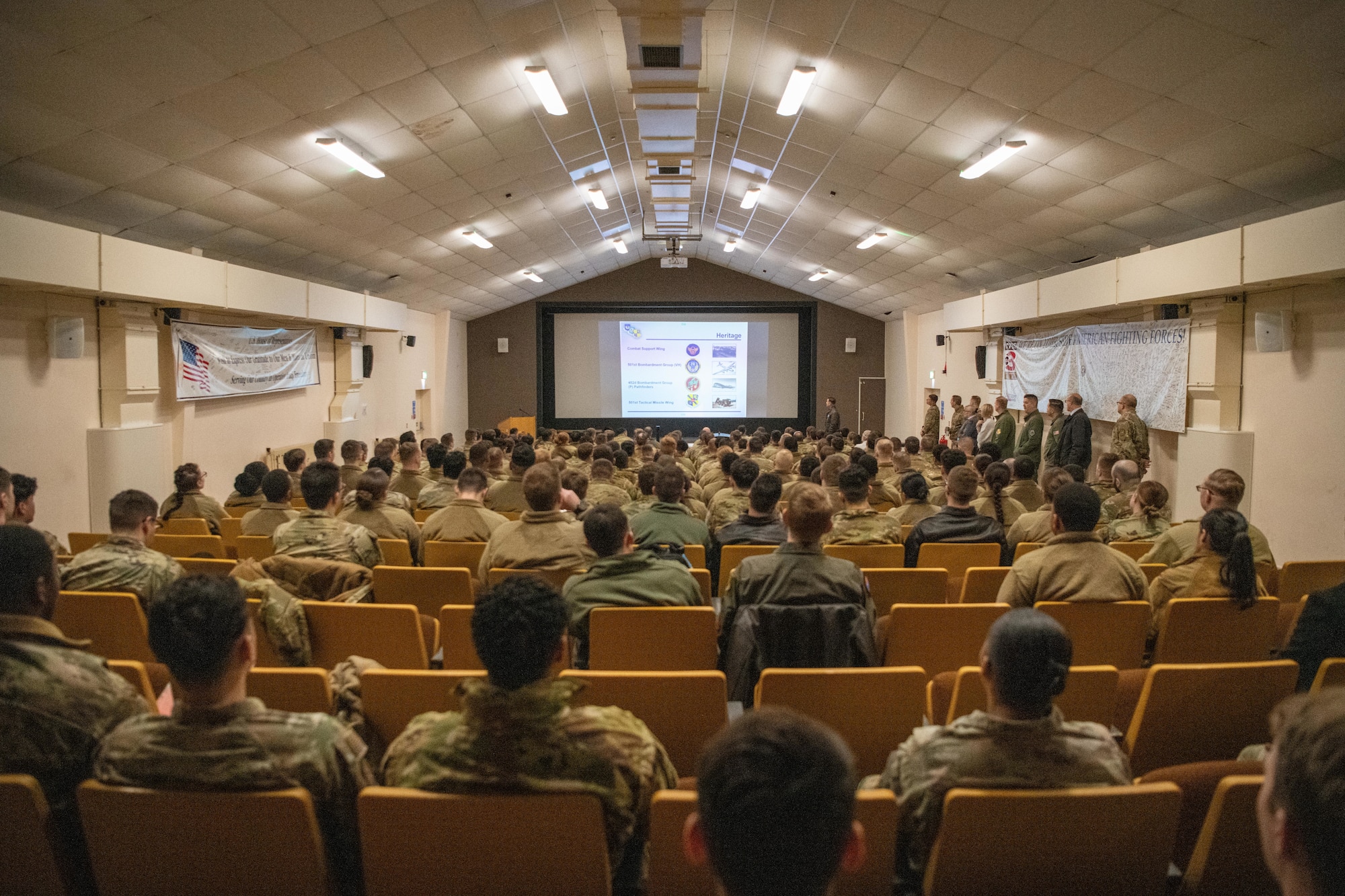 Airmen attend an in-processing brief