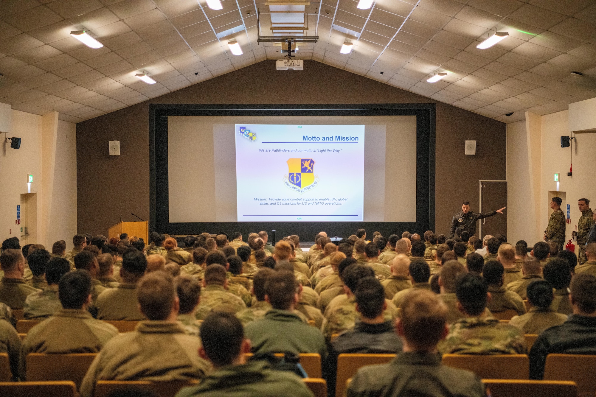 A leader speaks during a briefing