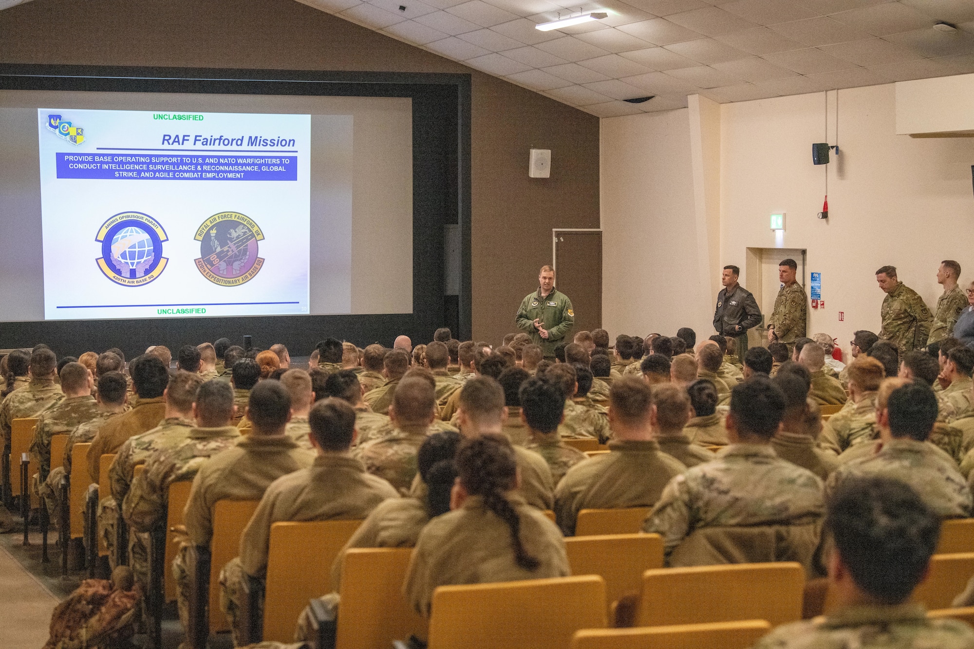 A leader speaks during a briefing