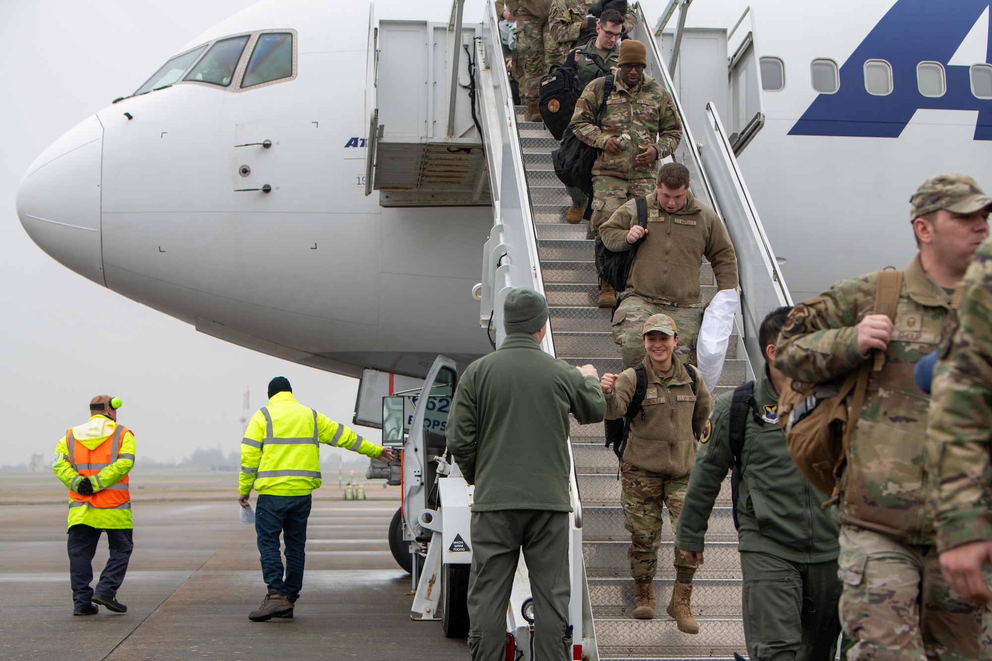 Airmen exit an Atlas Air Boeing 767 aircraft