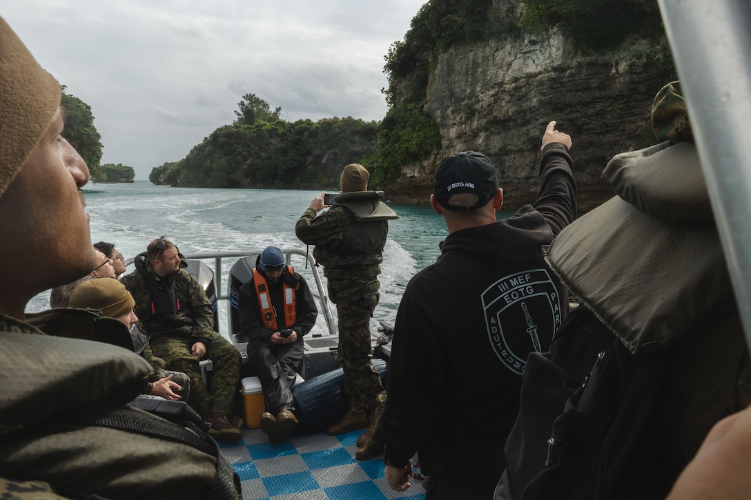 U.S. Marines with III Marine Expeditionary Force observe coastal cliffs during a nearshore field course near White Beach Naval Facility, Okinawa, Japan, Jan. 23, 2025. The Nearshore Field Course is a specialized training program designed to enhance mission readiness by educating operators and planners on the complexities of the nearshore environment.(U.S. Marine Corps photo by Cpl. Diego Garcia)
