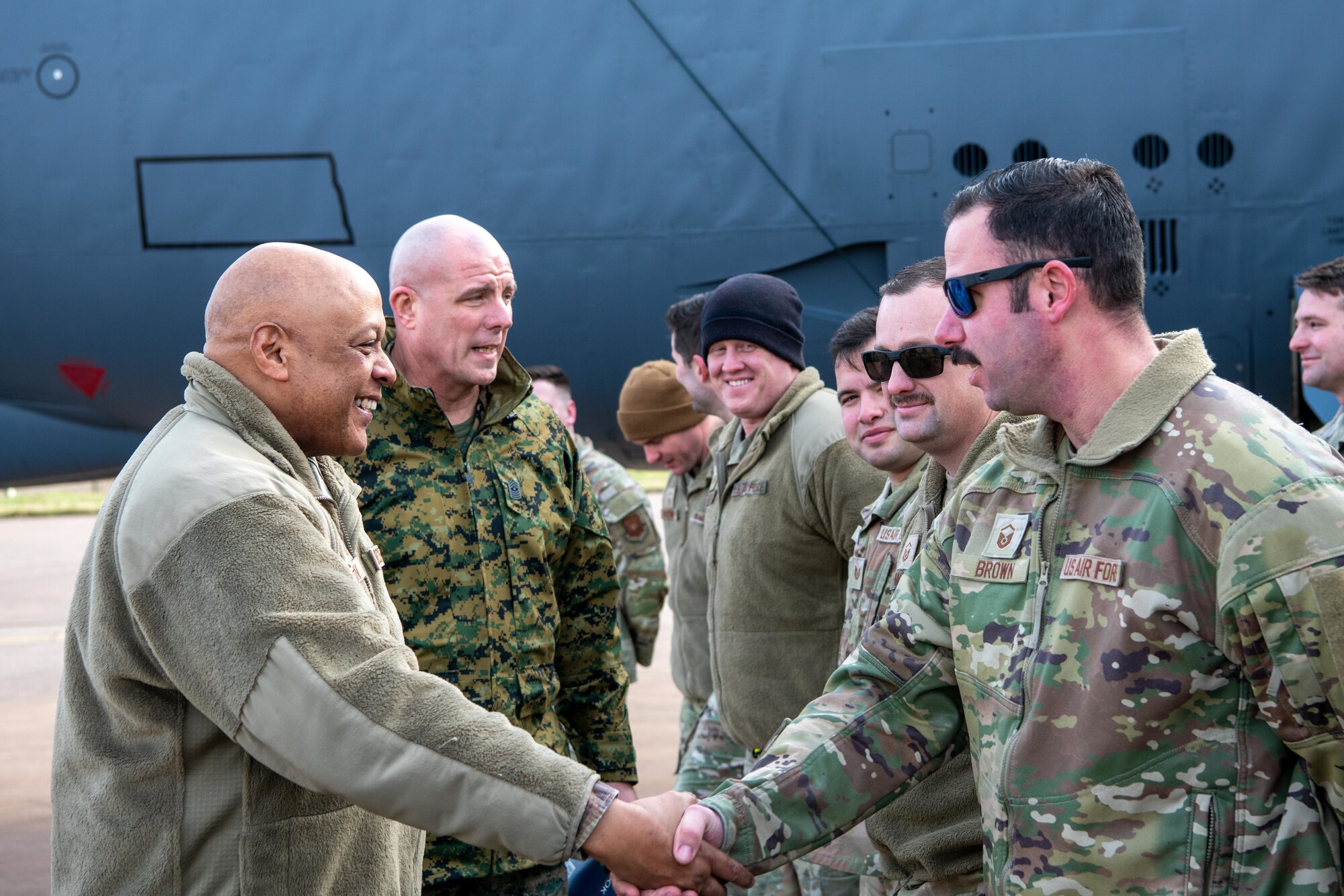 A leader shakes hands with deployed members
