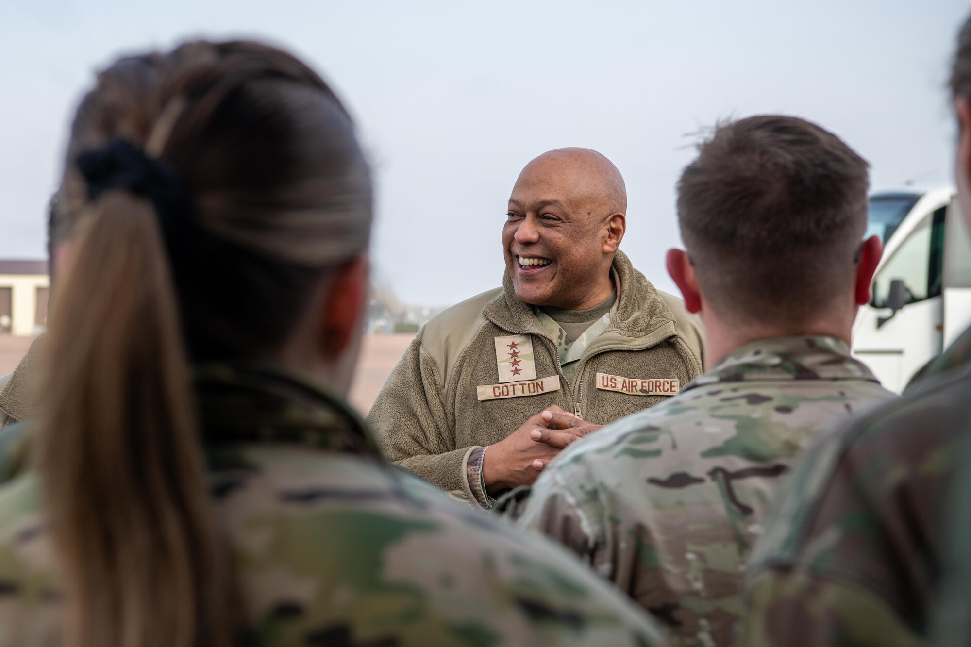 A leader speaks with deployed members