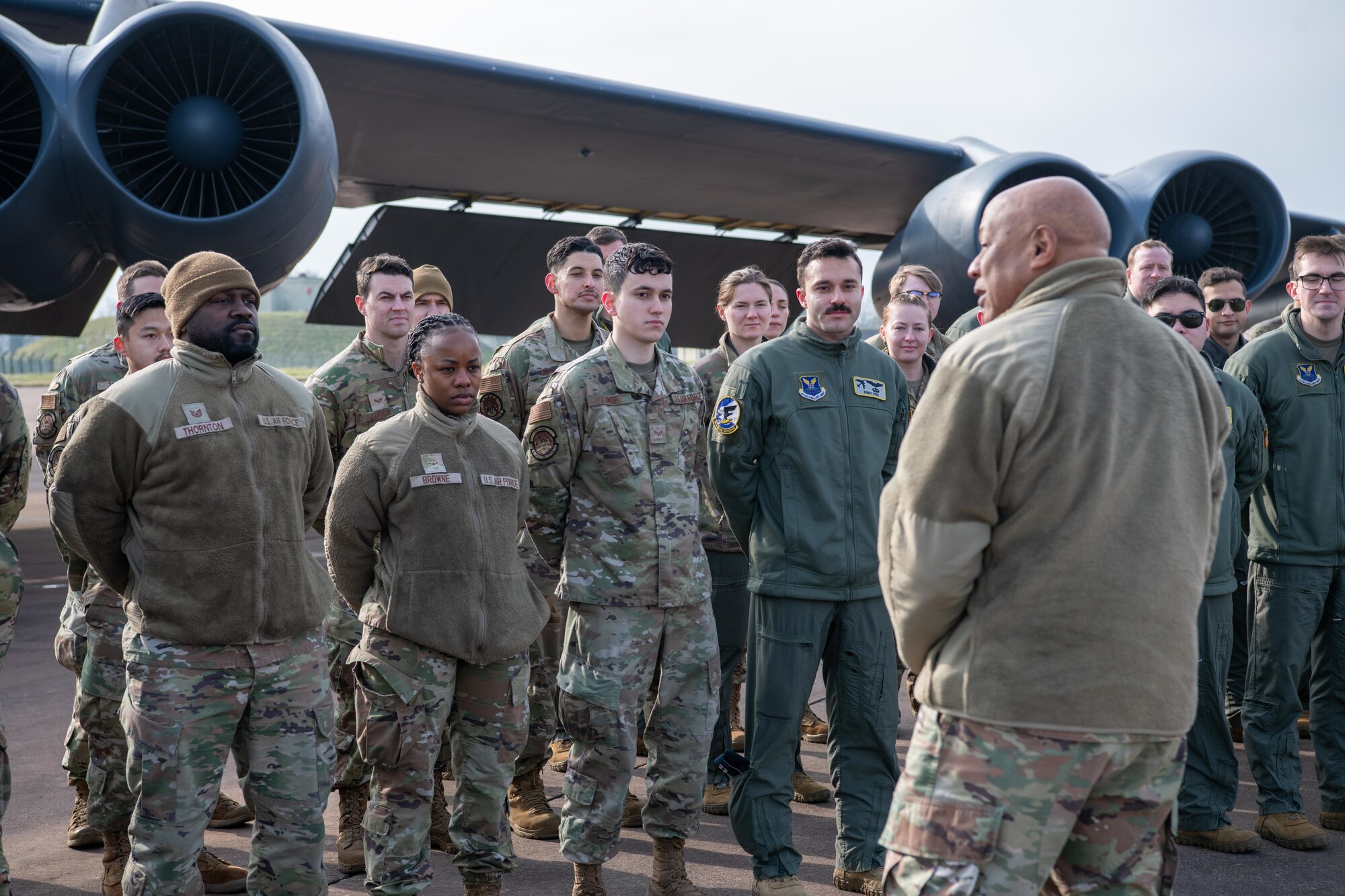 A leader speaks with deployed members