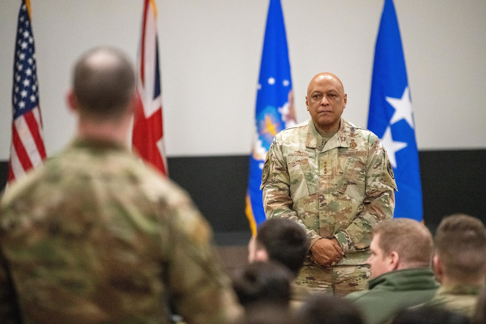 A leader listens to a question during an all call