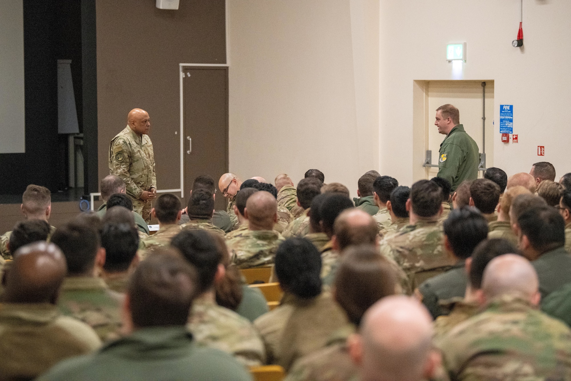 A leader listens to a question during an all call