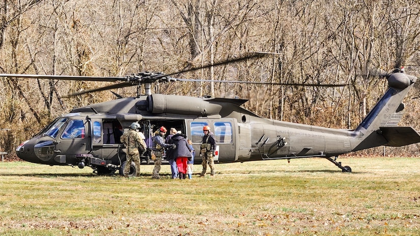 Airmen from the Kentucky Air National Guard’s 123rd Special Tactics Squadron evacuate 296 stranded residents from two housing complexes surrounded by floodwaters in Martin County, Kentucky, Feb. 17, 2025.