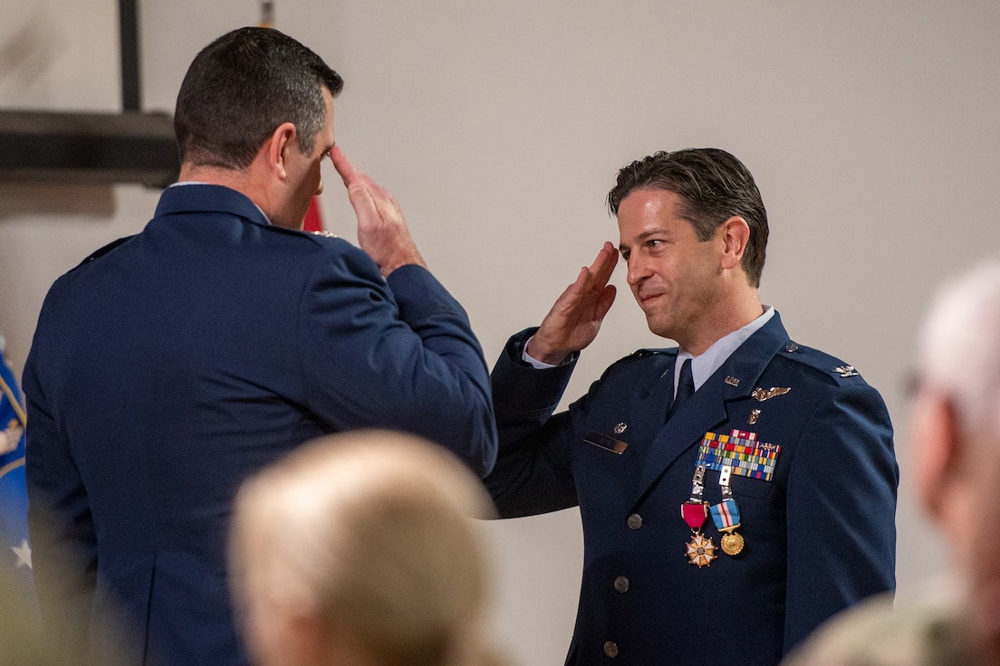 Col. Hans Otto, right, outgoing commander of the 123rd Medical Group, salutes Col. Matthew Quenichet, commander of the 123rd Airlift Wing, during Otto’s retirement ceremony at the Kentucky Air National Guard Base in Louisville, Ky., Dec. 15, 2024.