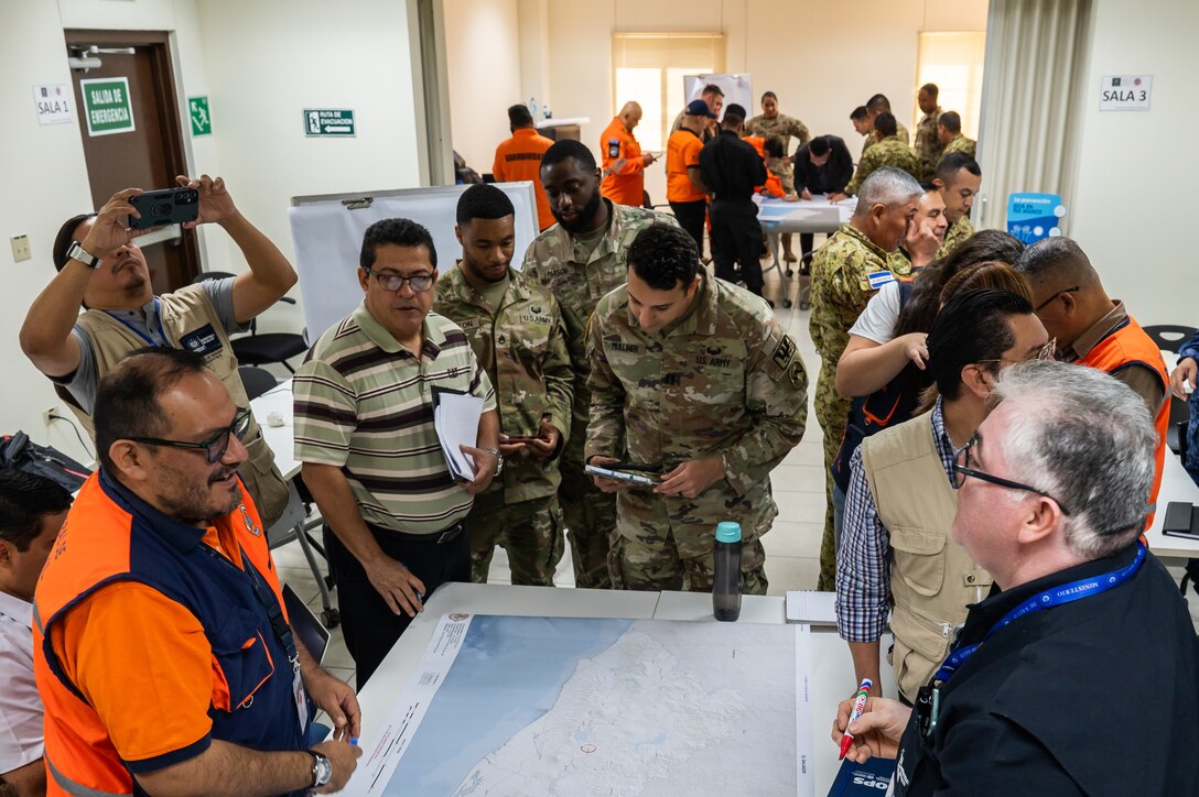 Members participating in the Jaguar Sentinel tabletop exercise work together during the scenario portion of the exercise in San Salvador, El Salvador, February 12, 2025.