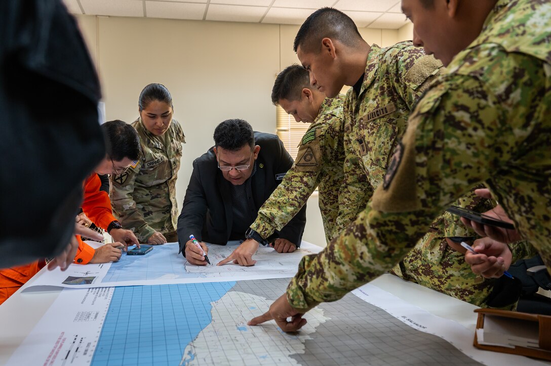 Members participating in the Jaguar Sentinel tabletop exercise work together during the scenario portion of the exercise in San Salvador, El Salvador, February 12, 2025.