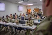 U.S. Army Col. Kenneth Bulthuis, second from left, commander of the 410th CSB, asks questions and gives feedback during mock briefings at a joint validation exercise (VALEX) at Fort Sam Houston, Texas, Feb. 13, 2025. Soldiers, Airmen and Civilians with the 410th Contracting Support Brigade (CSB), 502nd Contracting Squadron, 772nd Enterprise Sourcing Squadron (ESS) and 773rd ESS conducted a VALEX to assess and refine their ability to provide contracting support for military operations. (U.S. Army photo by Sgt. Joshua Taeckens)