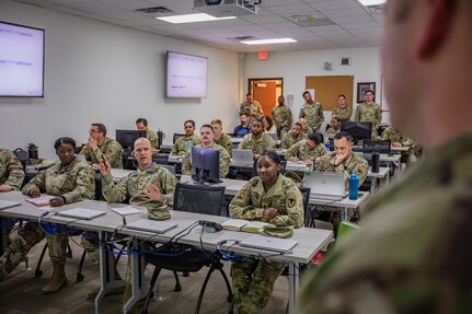 U.S. Army Col. Kenneth Bulthuis, second from left, commander of the 410th CSB, asks questions and gives feedback during mock briefings at a joint validation exercise (VALEX) at Fort Sam Houston, Texas, Feb. 13, 2025. Soldiers, Airmen and Civilians with the 410th Contracting Support Brigade (CSB), 502nd Contracting Squadron, 772nd Enterprise Sourcing Squadron (ESS) and 773rd ESS conducted a VALEX to assess and refine their ability to provide contracting support for military operations. (U.S. Army photo by Sgt. Joshua Taeckens)