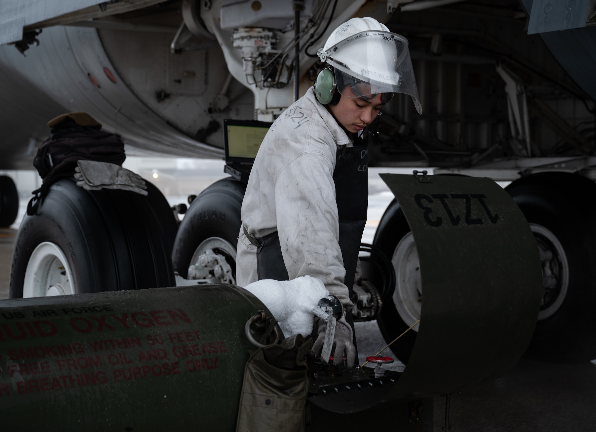 U.S. Airman 1st Class Brandon Rabago, 436th Aircraft Maintenance Squadron C-5M Super Galaxy apprentice, sets up a liquid oxygen connection to a C-5 at Dover Air Force Base, Delaware, Feb. 13, 2025. The C-5 was set for a vapor purge test conducted by the 46th Test and Evaluation Squadron. (U.S. Air Force photo by Airman 1st Class Liberty Matthews)