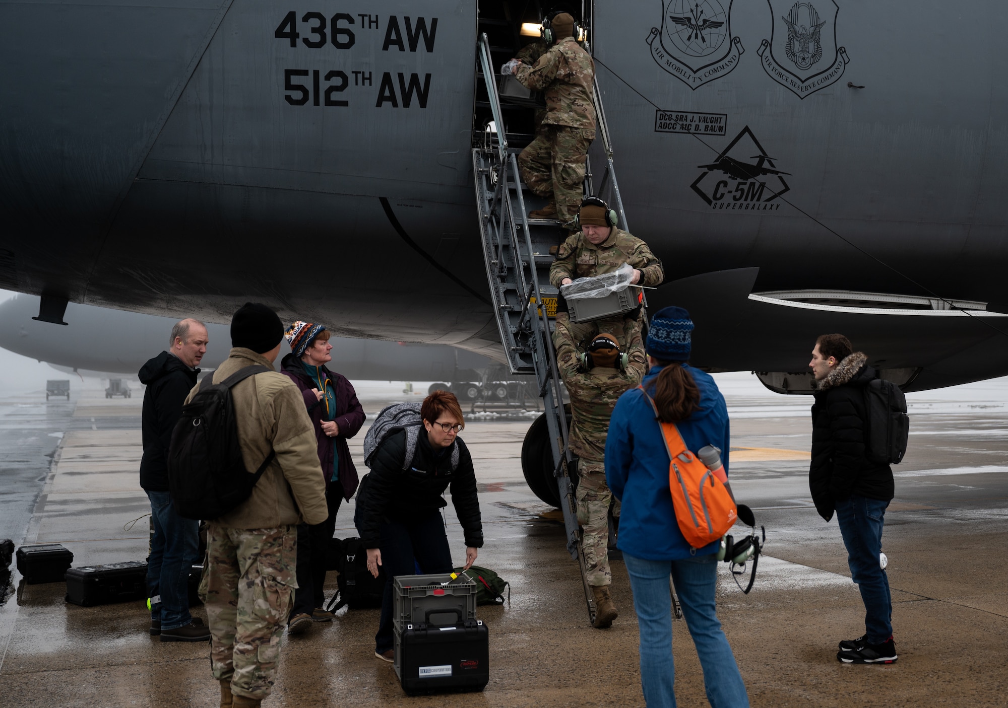 Members of the 46th Test and Evaluation Squadron and members of Team Dover load vapor purge testing equipment onto a C-5M Super Galaxy at Dover Air Force Base, Delaware, Feb. 13, 2025. Sensors placed inside the C-5 by the 46th TES measured how long it took for the vapor to be purged during flight. (U.S. Air Force photo by Airman 1st Class Liberty Matthews)