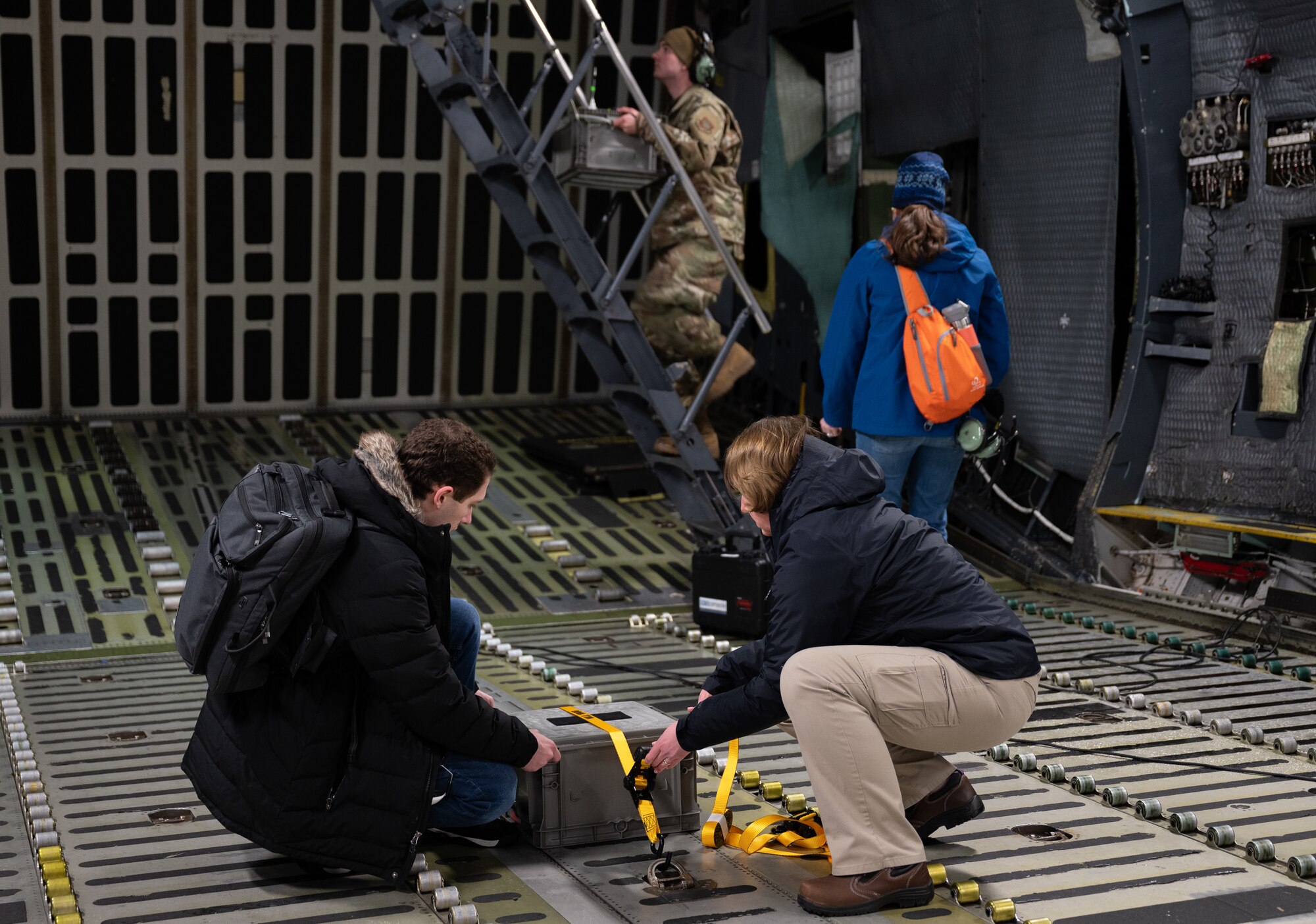 Members from the 46th Test and Evaluation Squadron and members of Team Dover strap and load vapor purge testing equipment onto a C-5M Super Galaxy at Dover Air Force Base, Feb. 13, 2025. Sensors placed inside the C-5 by the 46th TES measured how long it took for the vapor to be purged during flight. (U.S. Air Force photo by Airman 1st Class Liberty Matthews)