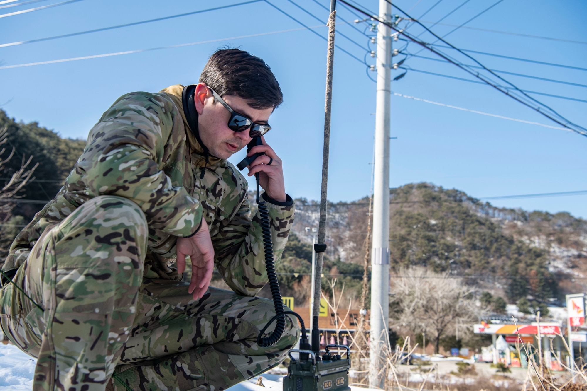 U.S. Air Force Staff Sgt. Kai Wakeland, 607th Air Support Operations Group joint terminal attack controller, contacts a joint fires observer in Hongcheon