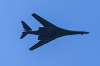 A U.S. Air Force B-1B Lancer assigned to the 34th Expeditionary Bomb Squadron, Ellsworth Air Force Base, S.D., tilts sideways while conducting a fly over at Aero India air show at Yelahanka Air Force Station, Bengaluru, India, Feb. 13, 2025.