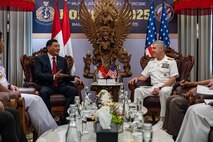 Adm. Steve Koehler, commander, U.S. Pacific Fleet, right, speaks with Sjafrie Sjamsoeddin, Indonesia’s minister of defense, during the 6th International Maritime Security Symposium (IMSS), held in conjunction with Multilateral Naval Exercise Komodo (MNEK) 2025, in Bali, Indonesia, Feb. 17.