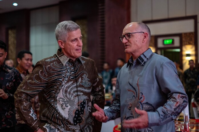 BALI, Indonesia (Feb. 16, 2025) - Adm. Steve Koehler, commander, U.S. Pacific Fleet, left, speaks with Rear Adm. Garin Golding, chief of the Royal New Zealand Navy, before joining him at a table for the Multilateral Naval Exercise Komodo (MNEK) 2025 welcome dinner in Bali, Indonesia, Feb. 16. Hosted by the Indonesian Navy, MNEK 2025 is an international, joint exercise taking place in the vicinity of Bali, Indonesia, emphasizing multilateral maritime cooperation and disaster response protocols. (U.S. Navy photo by Mass Communication Specialist 1st Class Caroline H. Lui)