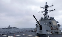 he Arleigh Burke-class guided-missile destroyer USS Dewey (DDG 105) sails alongside the Japan Maritime Self-Defense Force Asahi-class destroyer JS Asahi (DD-119) during bilateral operations in the Philippine Sea, Feb. 10, 2025.