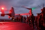 U.S. Marines with Battalion Landing Team 2/4, 31st Marine Expeditionary Unit, embark an U.S. Marine Corps MV-22 Osprey with Marine Medium Tiltrotor Squadron 262 (Rein.) aboard the amphibious assault ship USS America (LHA 6), during a tactical recovery of aircraft and personnel exercise in the Philippine Sea, Feb. 13, 2025.