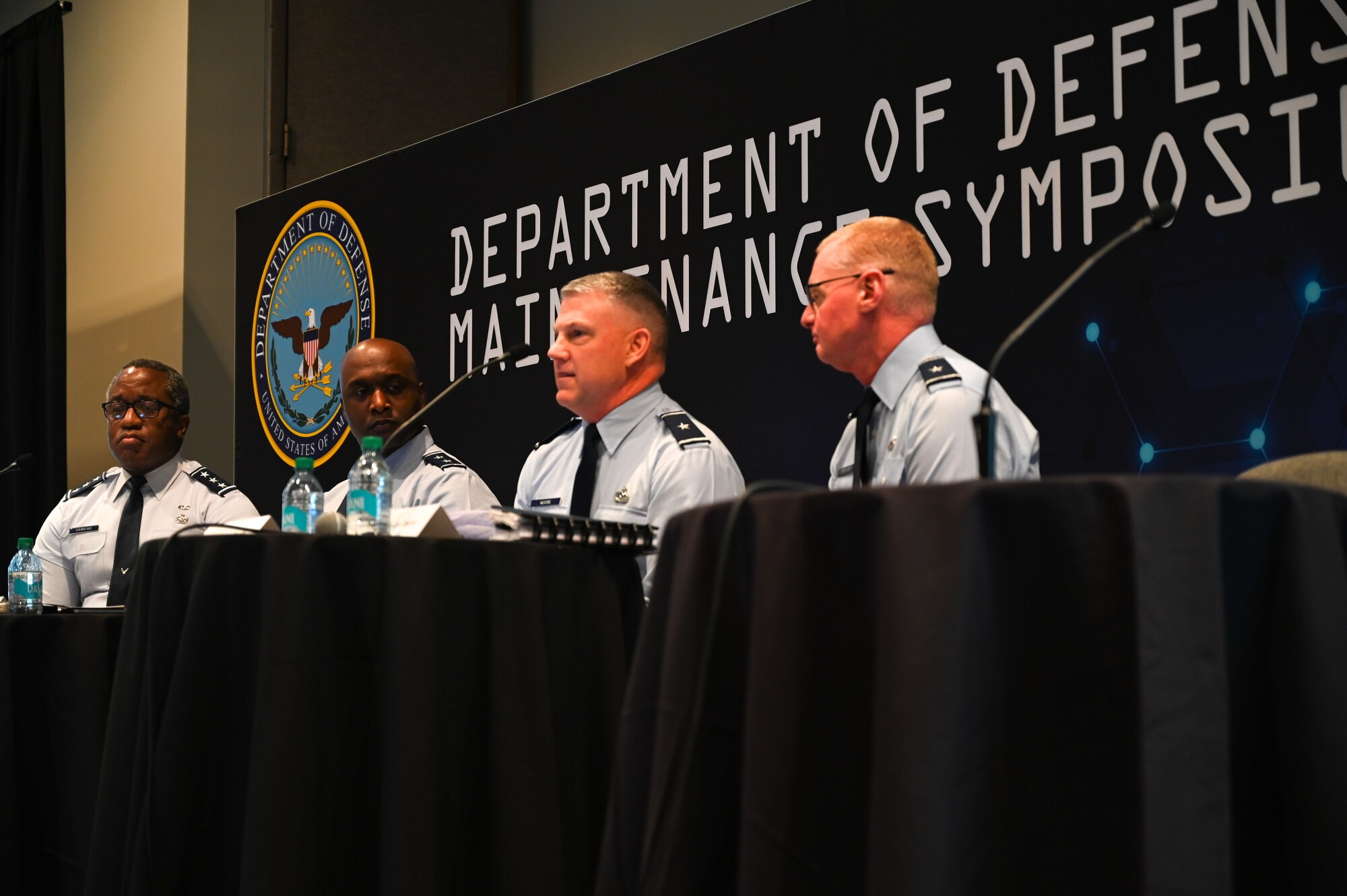 Military men hosting a town hall meeting