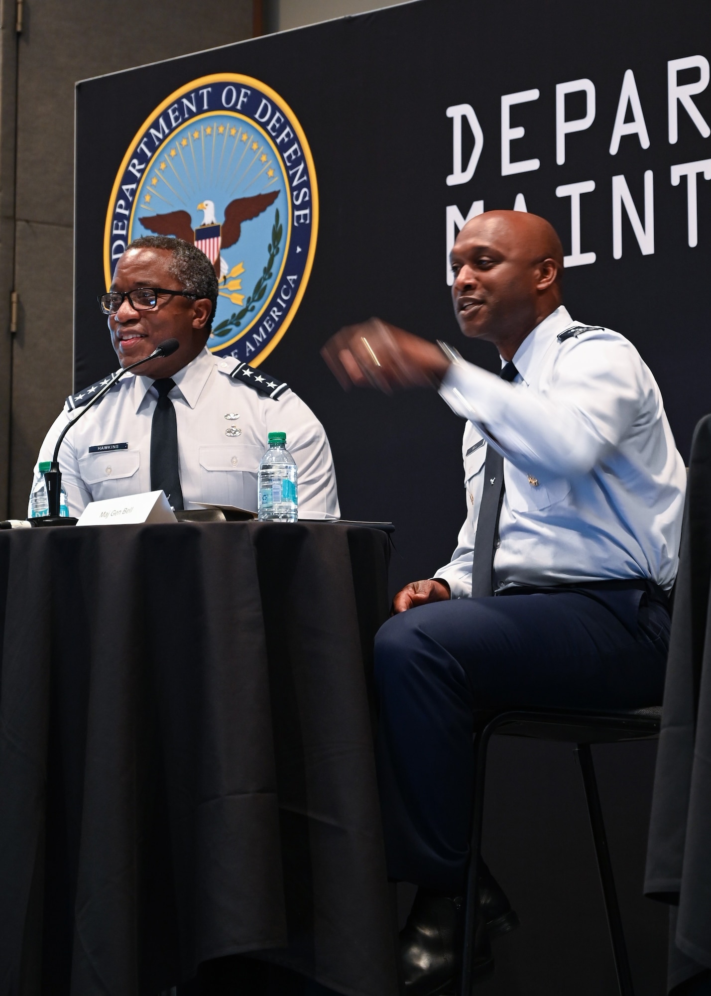 Military men hosting a town hall meeting