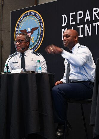 Military men hosting a town hall meeting