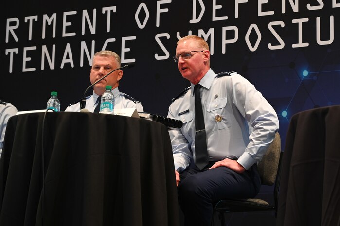Military men hosting a town hall meeting