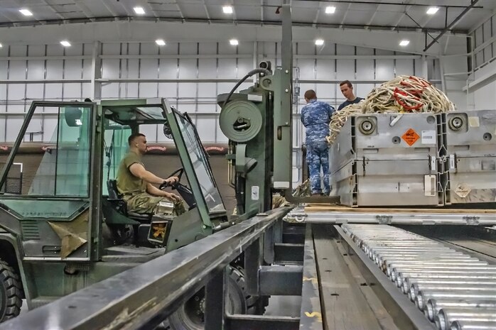 The 75th Mission Support Group hosted the Royal Australian Air Force in a combined 649th Munitions Squadron and 75th Logistics Readiness Squadron mission in this past week. The squadrons assisted the RAAF Mobile Air Load Team in palletizing and preparing Australian munitions for transport.  (U.S. Air Force Photo by Staff Sgt Mohammad Ebrahimi)