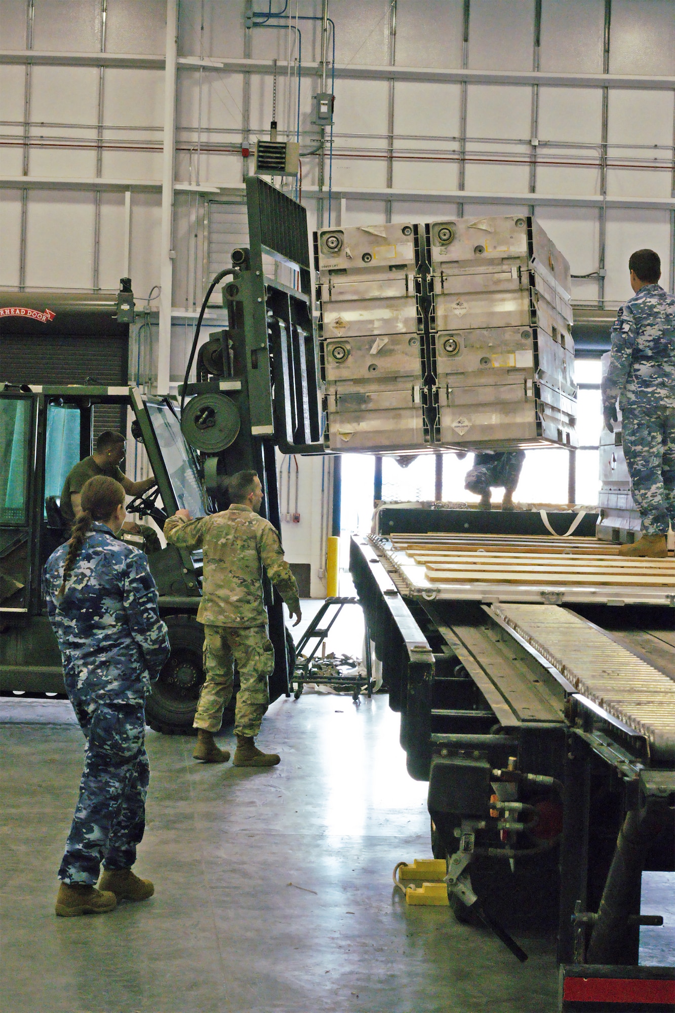 The 75th Mission Support Group hosted the Royal Australian Air Force in a combined 649th Munitions Squadron and 75th Logistics Readiness Squadron mission in this past week. The squadrons assisted the RAAF Mobile Air Load Team in palletizing and preparing Australian munitions for transport.  (U.S. Air Force Photo by Staff Sgt Mohammad Ebrahimi)