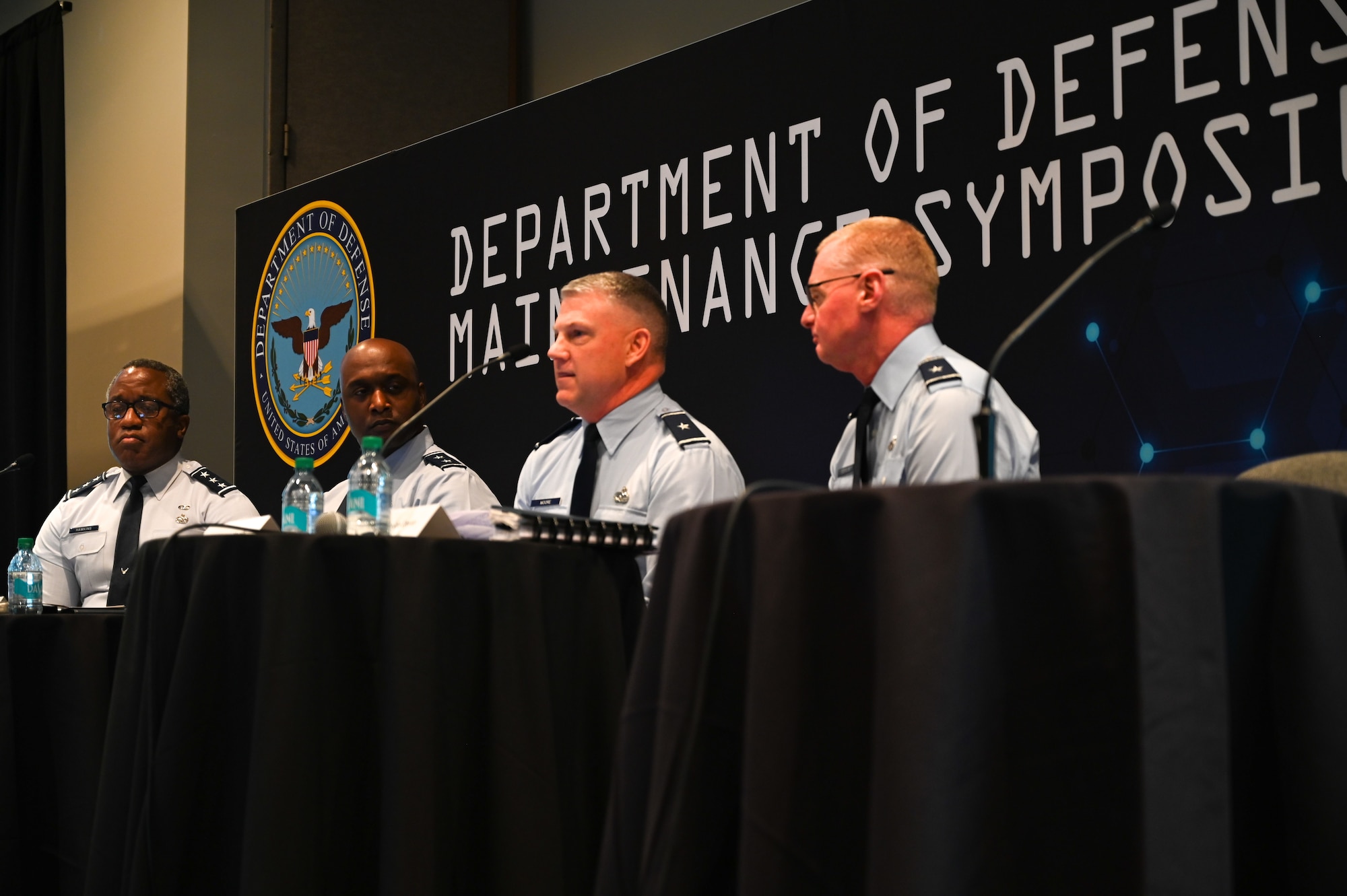 Military men hosting a town hall meeting