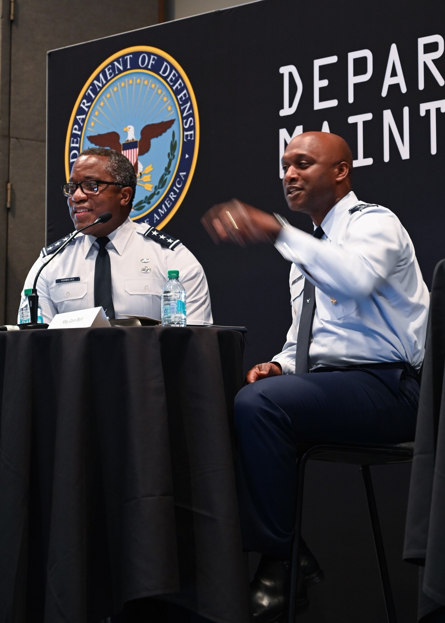 Military men hosting a town hall meeting