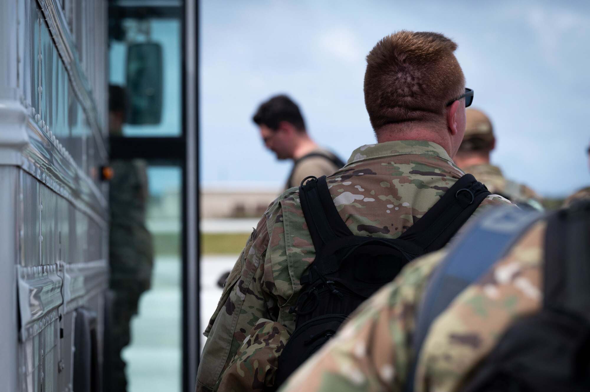 Airmen boarding a bus
