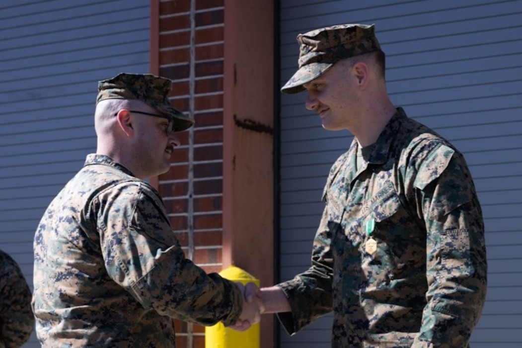 U.S. Marine Corps Sgt. Joshua Grimison, the armory maintenance chief of 2d Light Armored Reconnaissance Battalion, is presented the Navy and Marine Corps Commendation Medal on Marine Corps Base Camp Lejeune, North Carolina, Feb 14, 2025. Grimison was awarded the Navy and Marine Corps Commendation Medal for providing the highest standards of accurate and reliable management for Calibration and Infantry Weapons Gage Calibration programs within the armory. (U.S. Marine Corps photo by Lance Cpl. Judith Ann Lazaro)