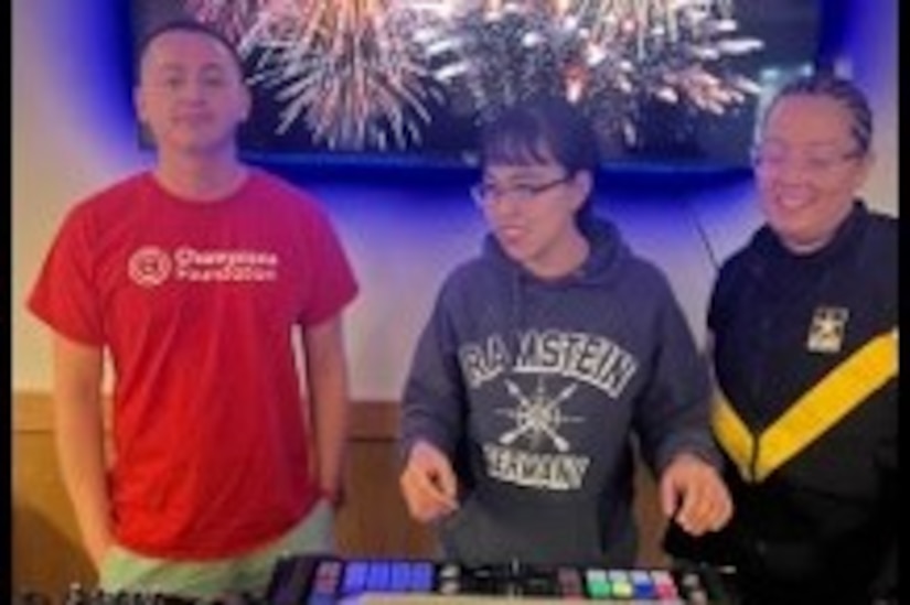 Soldiers are having fun learning how to mix songs on the sound system in DJ class at JBLM.