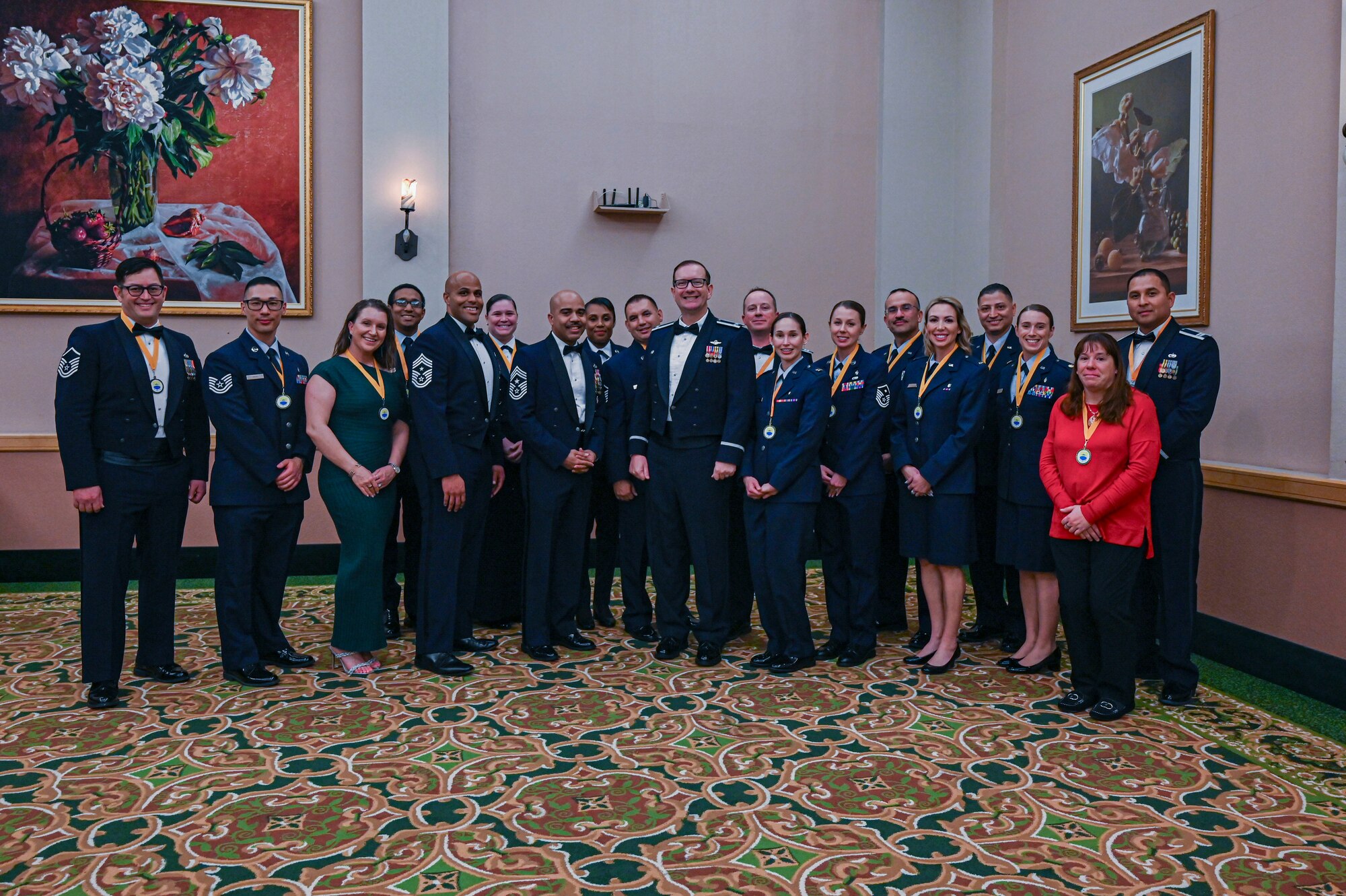 Chief Master Sgt .Johnathan Birk (front left), 433rd Airlift Wing command chief, Chief Master Sgt. Israel Nuñez (front center), Senior Enlisted Advisor to the Chief of Air Force Reserve, and Col. Douglas C. Jeffrey IV (front right), 433rd AW commander, pose for a group photo with the annual award nominees before the 14th Annual Alamo Wing Awards Banquet at the Gateway Club on Joint Base San Antonio-Lackland, Texas Feb. 01, 2025.