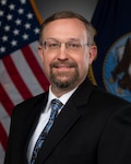 Professional headshot of a male