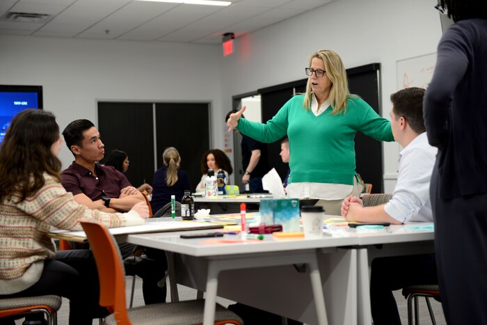 Kristi Hilbert, AETC Senior Strategic Media Advisor for Total Force interacts with attendees during the AETC Public Affairs Gen Z focus group in San Antonio, Texas, Feb 3-7, 2025. Air Education and Training Command officials hosted its first Gen Z focus group, bringing together public affairs professionals to explore how the Air Force can better connect with the next generation through modern communication strategies and engagement efforts.