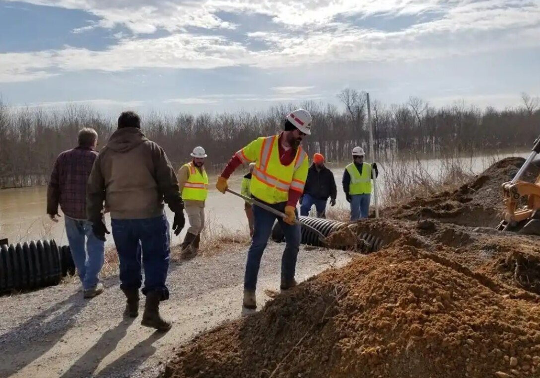 IN THE PHOTO, Memphis District floodfighters, working with our local partners from the Cairo (Illinois) Drainage District, Alexander County Emergency Management, and Illinois Emergency Management Agency, yesterday (Feb. 21) installed and began operating a high capacity pump at Cottonwood Slough. This is located between the communities of Urbandale and Mound City, Illinois. 

The Corps of Engineers provided the 16-inch pump and local officials supplied a 310 horsepower tractor to drive it. The pump is removing interior water from the protected side of the levee resulting from heavy rains and backwater from Cache River and pumping it over the mainline levee and into the Ohio River. The Memphis District is today sending a portable Automatic Power Unit (APU) to the area to operate a second pump. Partnerships like this are a key element of every successful floodfight.