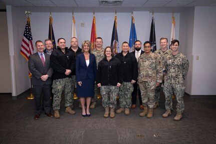 Chief of Naval Operations Adm. Lisa Franchetti takes a group photo with Sailors and Navy civilians at Naval Support Activity (NSA) Crane, in Crane, Indiana, Feb. 10, 2025.