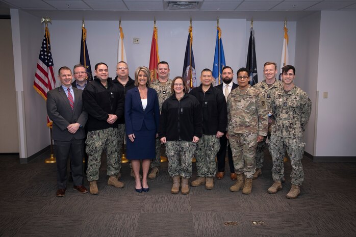 Chief of Naval Operations Adm. Lisa Franchetti takes a group photo with Sailors and Navy civilians at Naval Support Activity (NSA) Crane, in Crane, Indiana, Feb. 10, 2025.