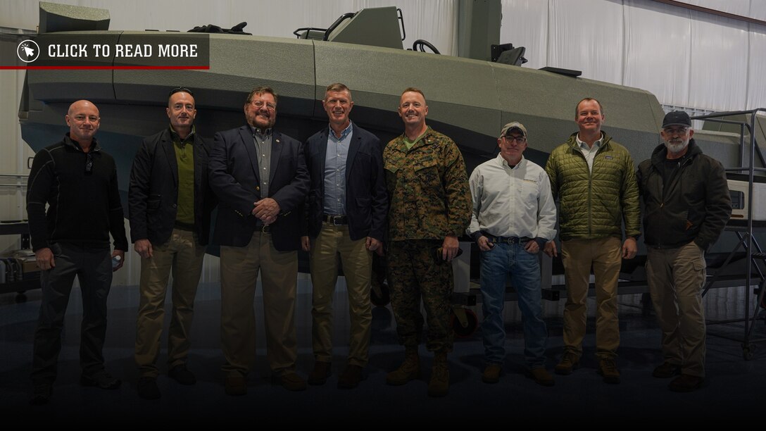 U.S. Marine Corps command group with 4th Marine Division, pose with representatives of The Whiskey Project in front of the Multi Mission Reconnaissance Craft-A littoral craft before conducting pre-delivery inspection trials in Edenton, North Carolina, Jan. 28, 2025. The predelivery inspection allows the naval architects to ensure that the MMRC-A performs and meet naval standards in small craft (U.S. Marine Corps photo by Cpl. Aaron TorresLemus)