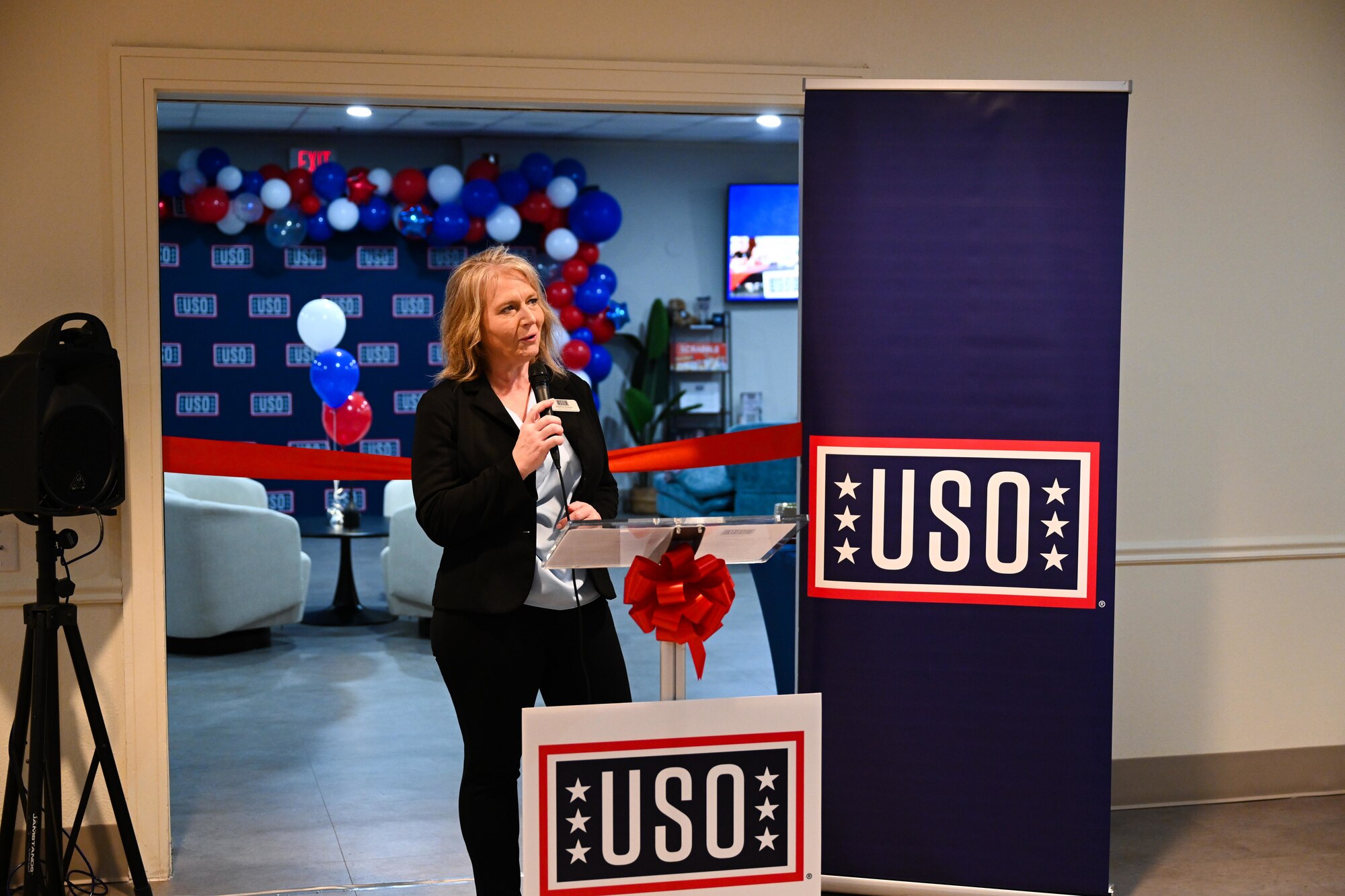 Heather Krauss, USO executive director, speaks at United Service Organizations (USO) day room ribbon cutting ceremony at Laughlin Air Force Base, Feb. 4, 2025. This is the first time in Laughlin’s history to have a physical location on base, providing a dedicated space for the USO to deliver their mission at a regular tempo.